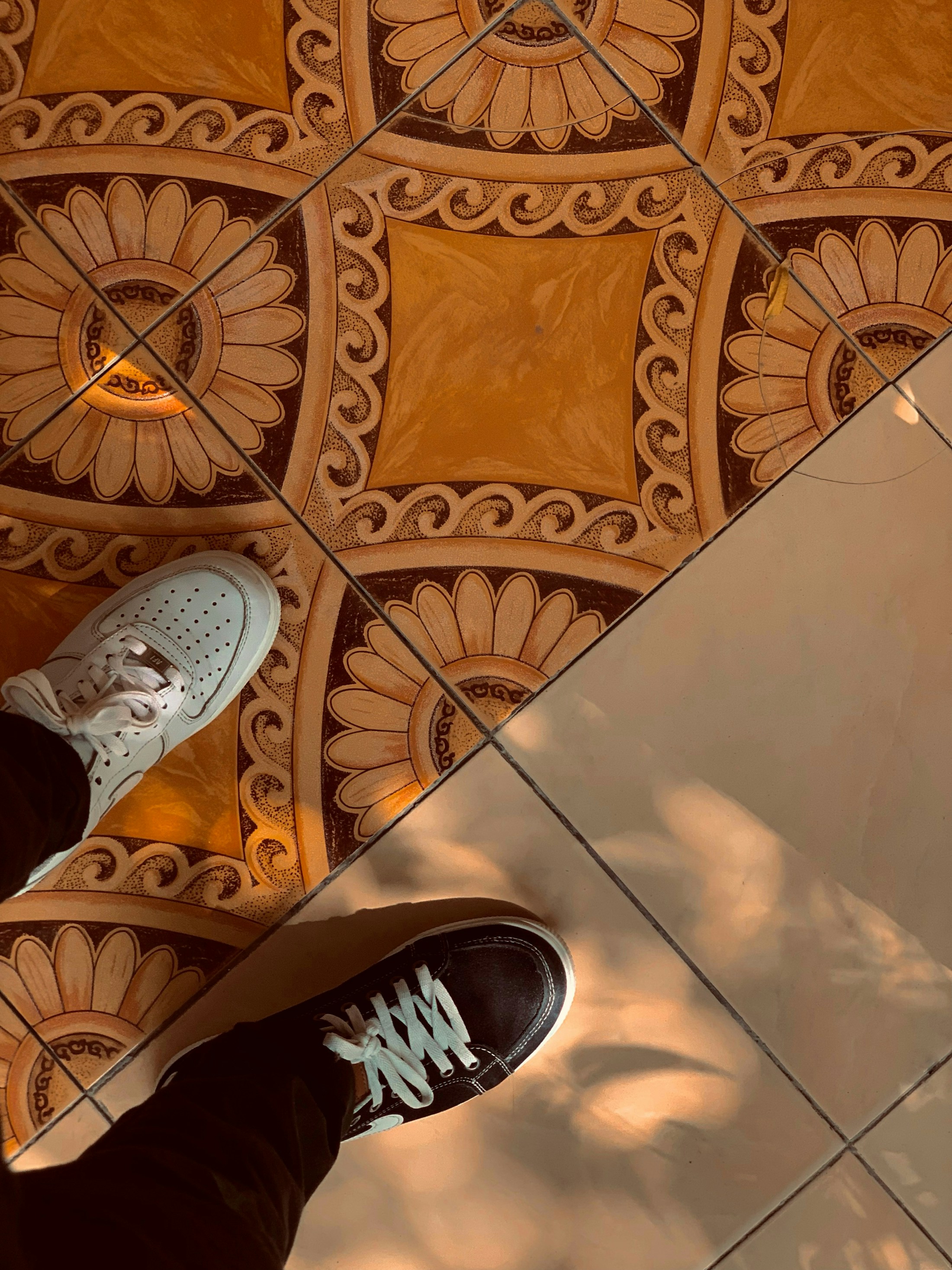 A quiet detail from Mogadishu — two steps, warm patterns, and sunlight touching the floor like a small piece of memory.